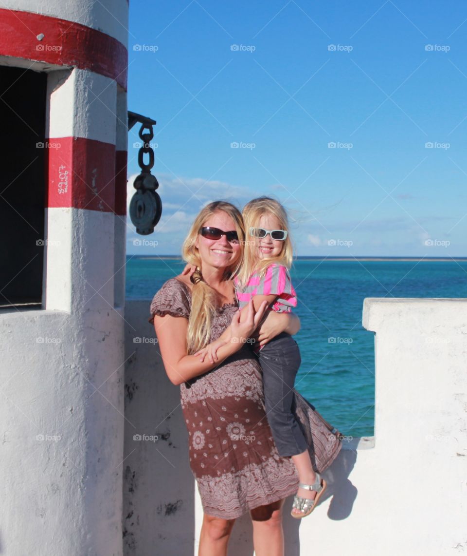 Mother and daughter on top of a lighthouse 