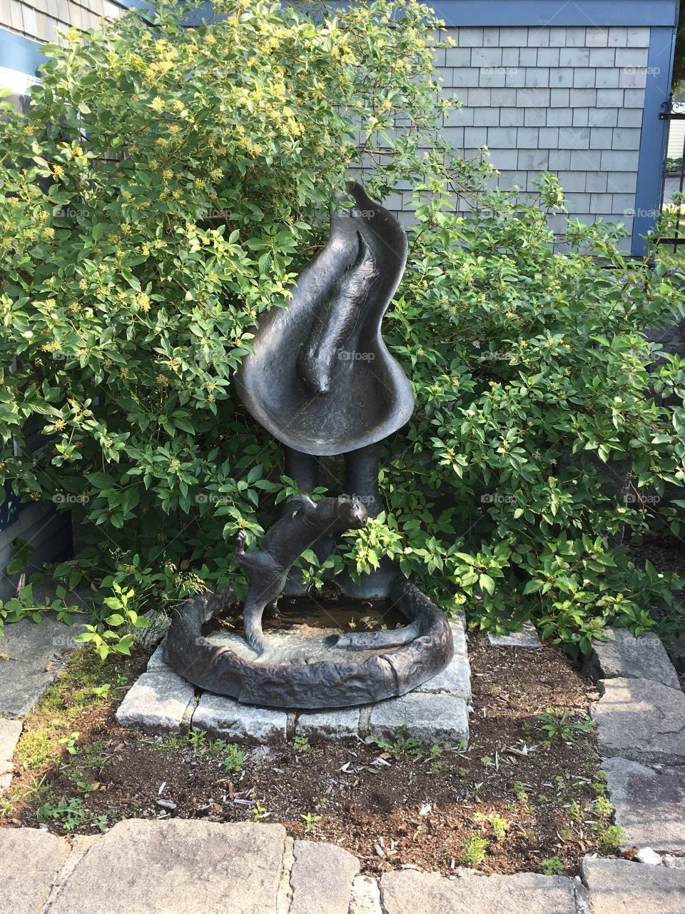 Sculpture of an otter with fountain