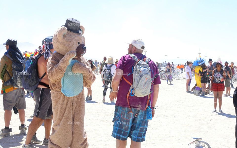 Bears are people too. This bear had just given this guy a bear hug moments before this shot