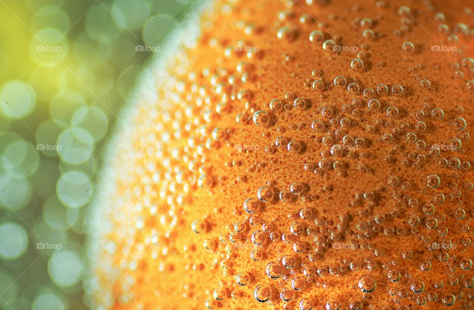 Extreme close-up of a waterdrops orange