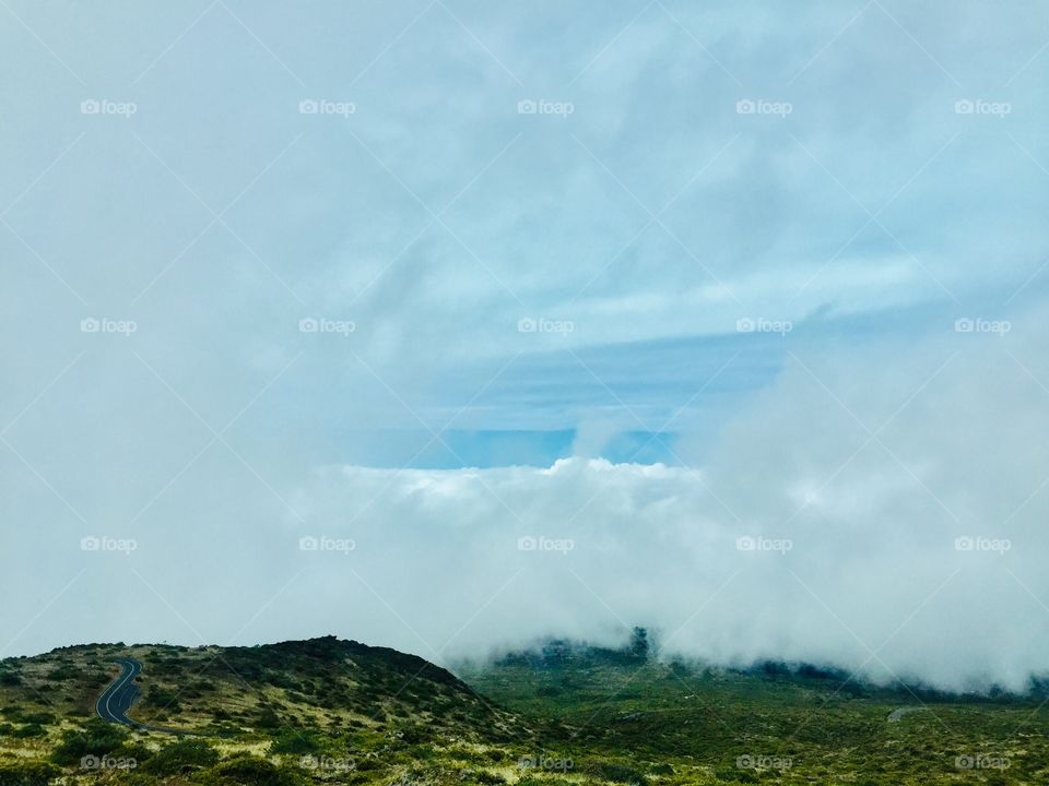 Above clouds top of the volcano 