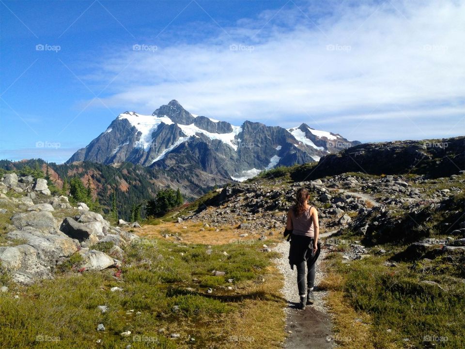 Girl walking in the cascade mountain range in Washington State