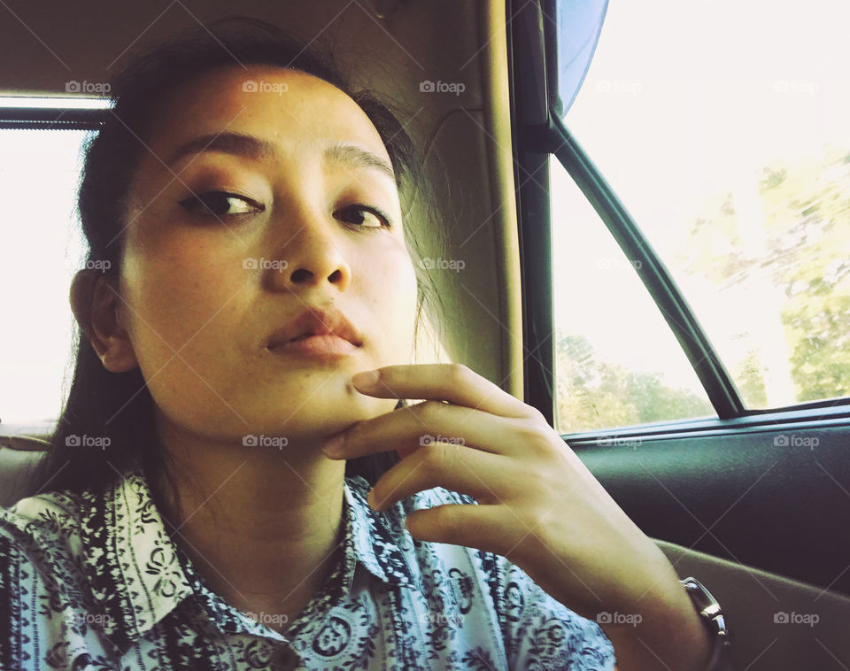 True Thai woman face who seem thinking somthing