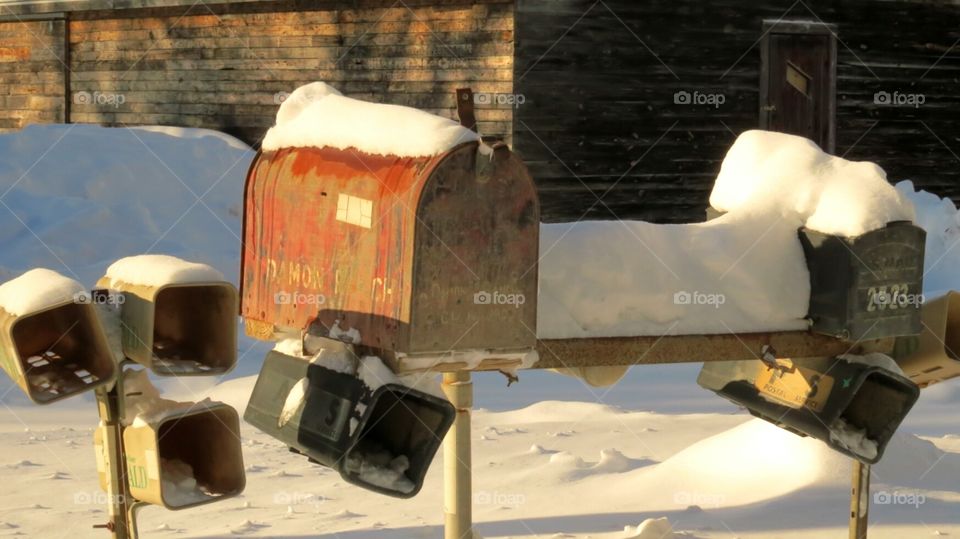 Old mailboxes lined up like soldiers