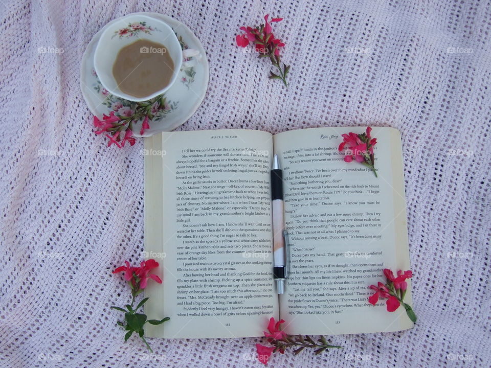 Book, flowers, and tea