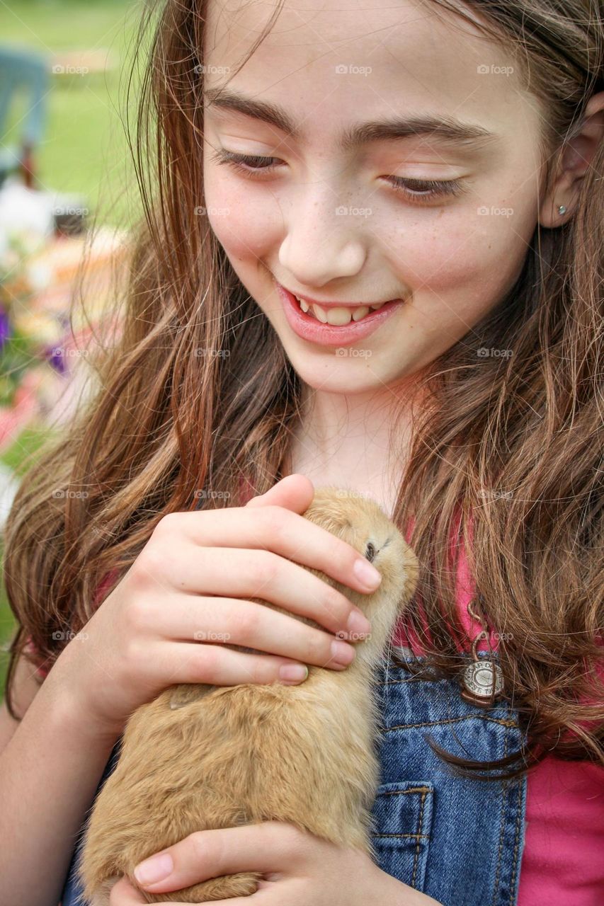 Girl with her per rabbit
