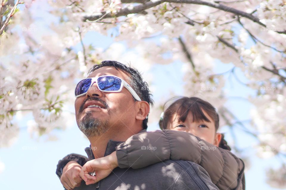 Spring portrait of a father and a daughter