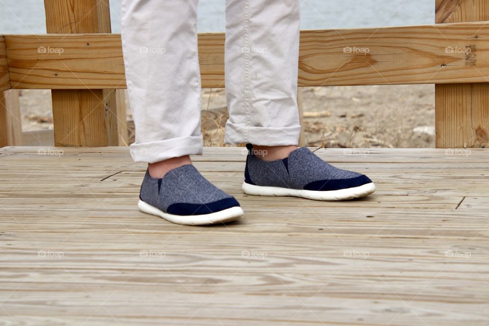 Man wearing Isotoner shoes on boardwalk 