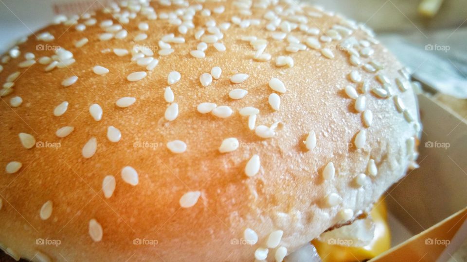 Top view of a hamburger. Image featuring sesame seeds on the bun or patty.