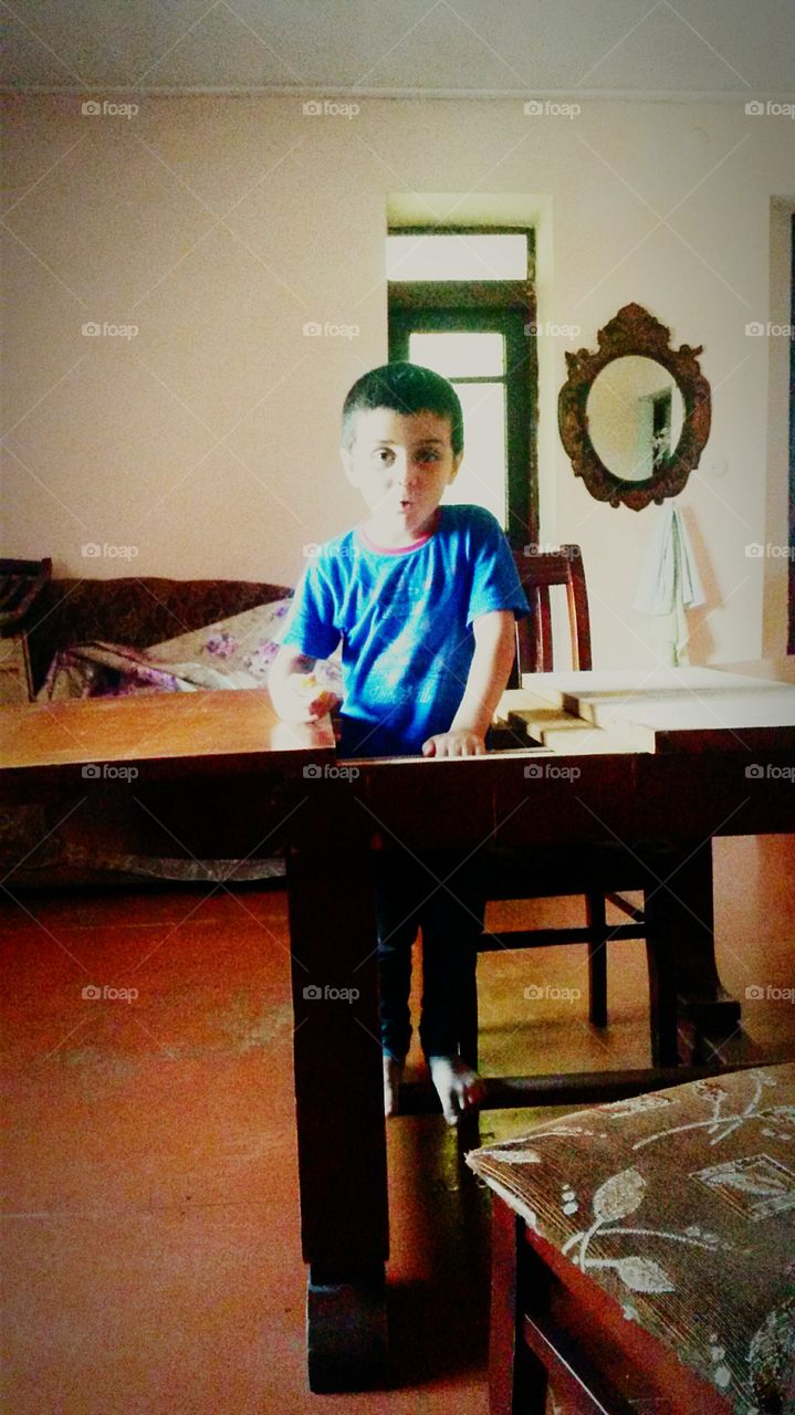 child inside an old table