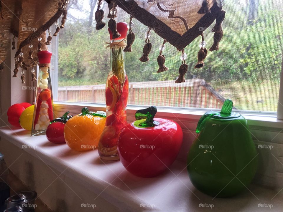 Kitchen window with art glass bright colorful vegetables 