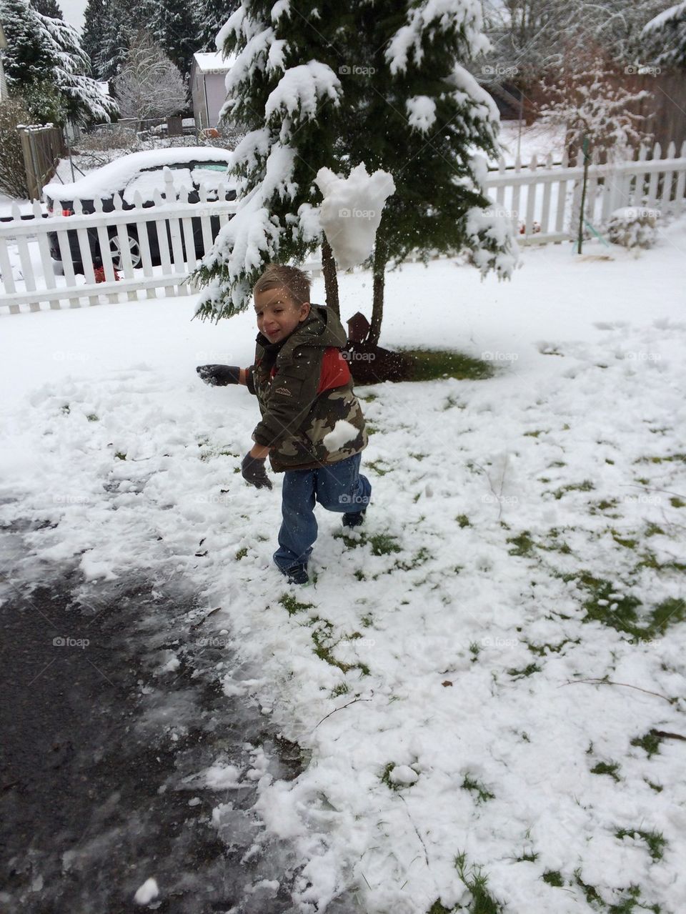 Boy throwing snowball