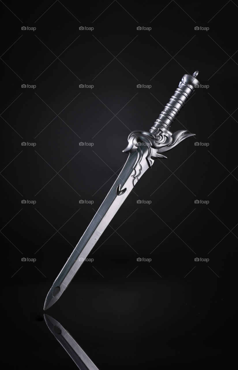 Sharp Dagger knife sword on black background
