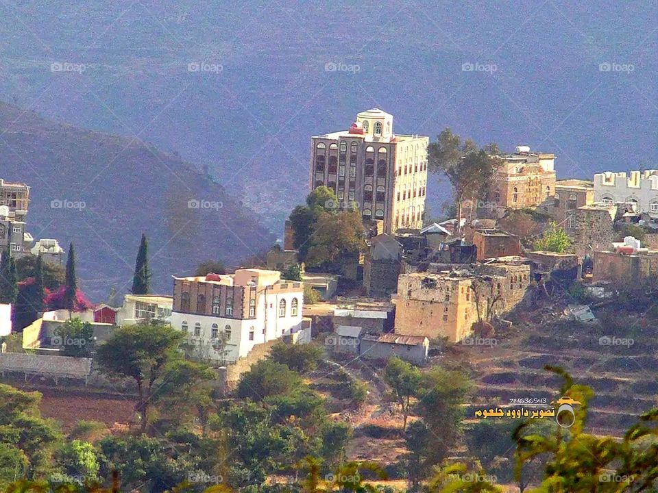 A stunning view of green mountains covered in fog in Yemen