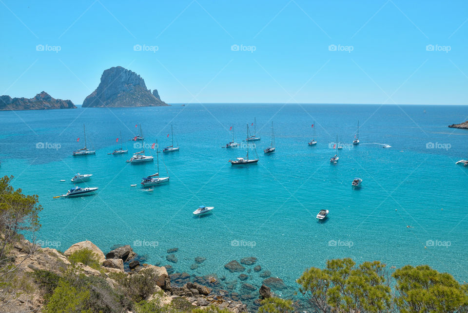 Boat sailing in sea on a sunny day