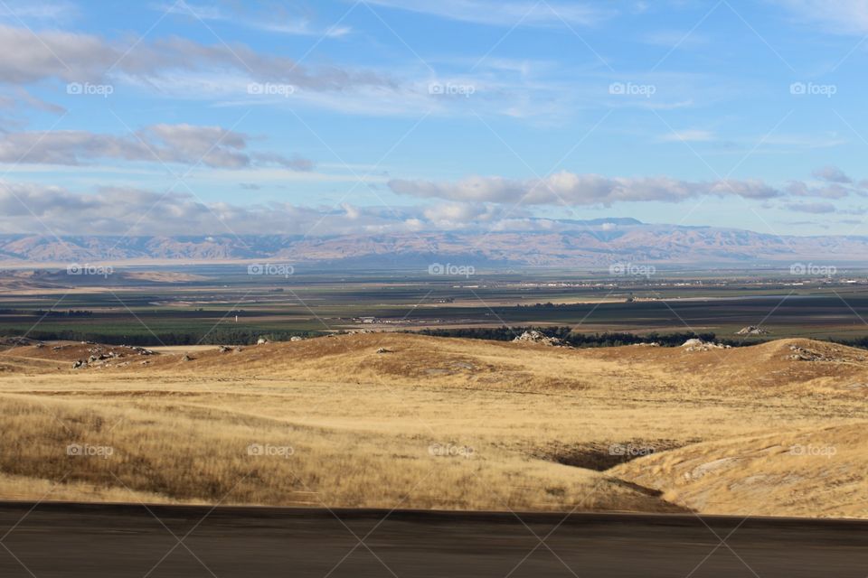 wide open space, road trip to Las Vegas. Outdoors. clouds. mountains