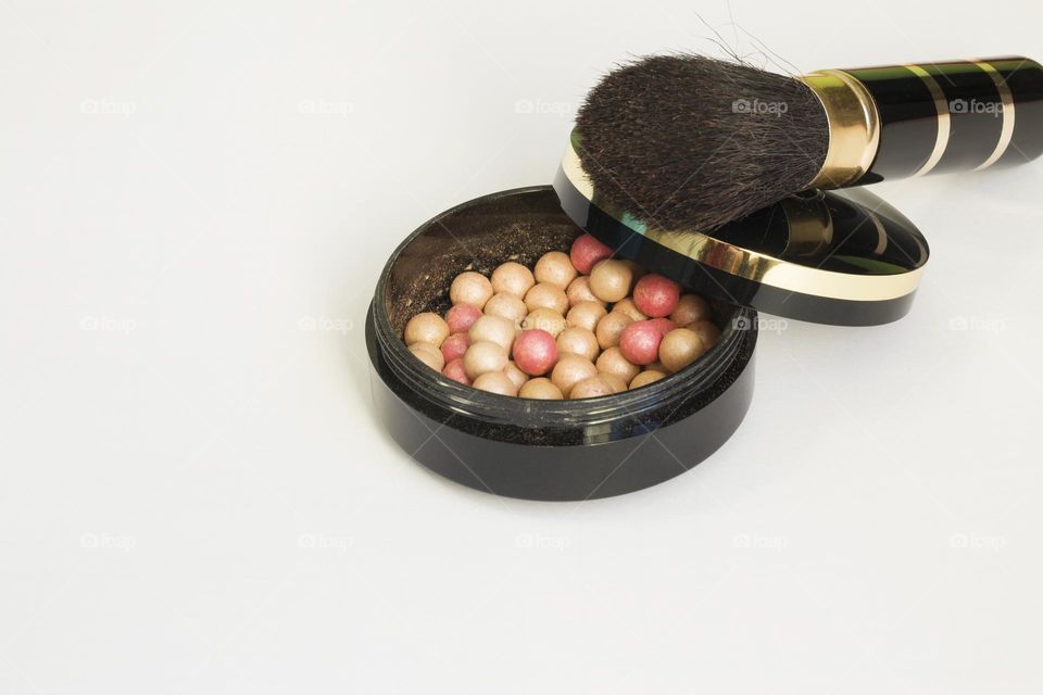 Blush of multicoloured beads and brush