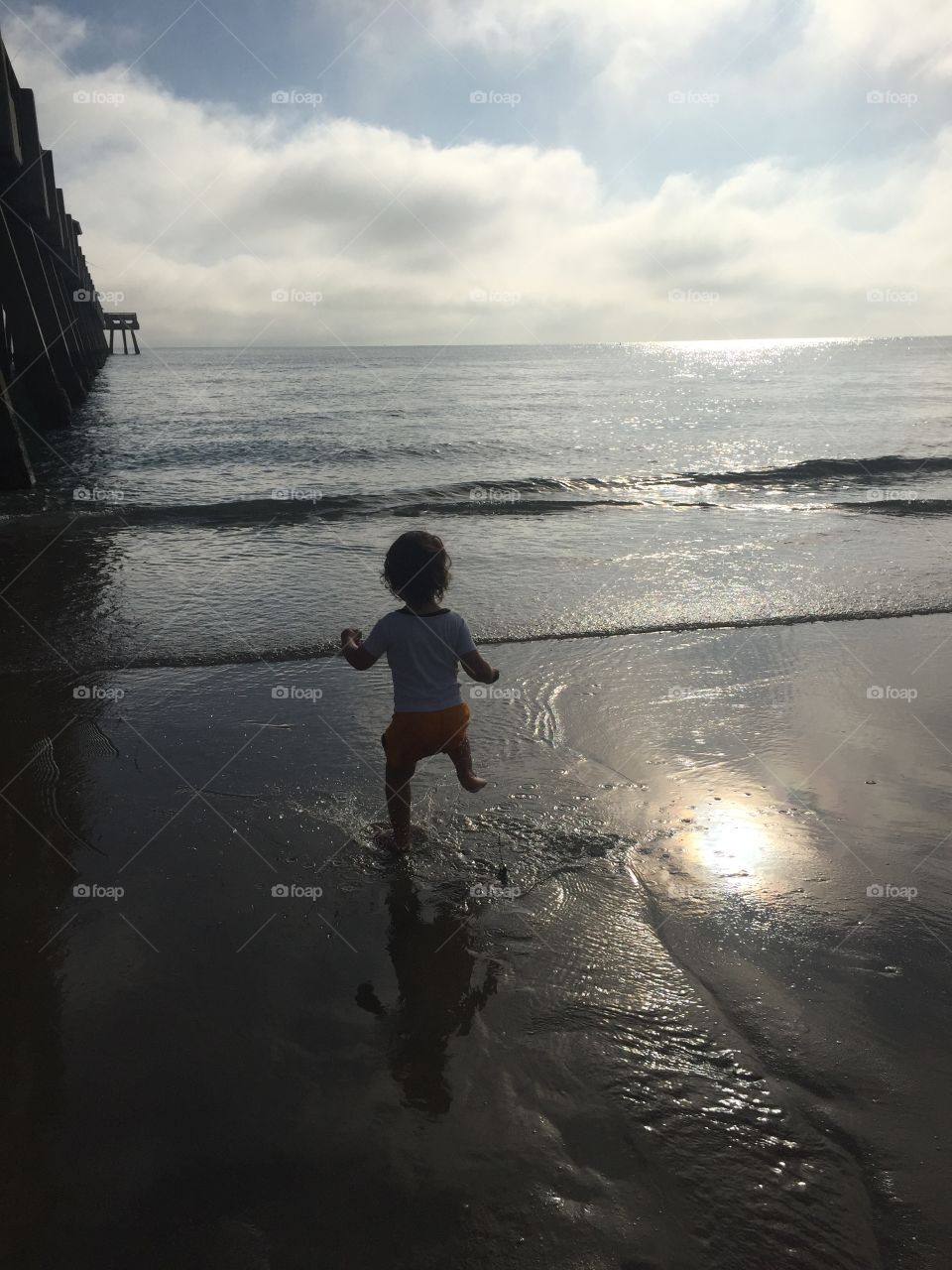 Brody dancing by the ocean
