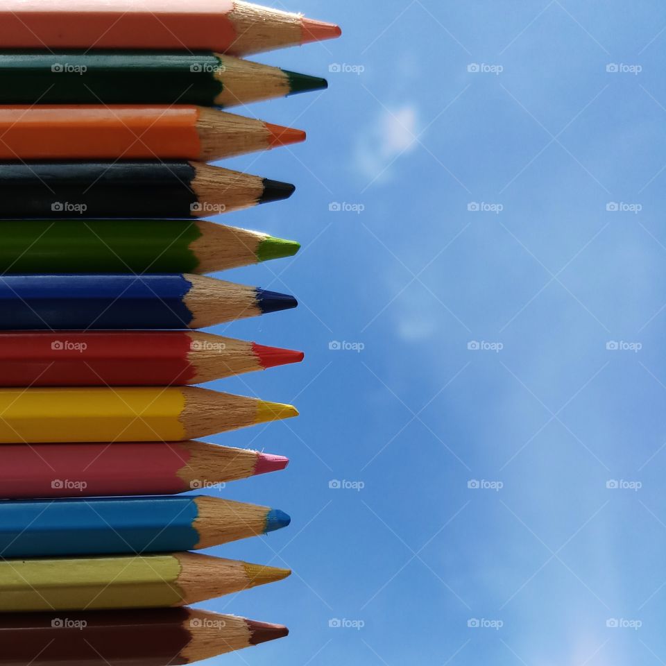 Colour pencils laying at sky.