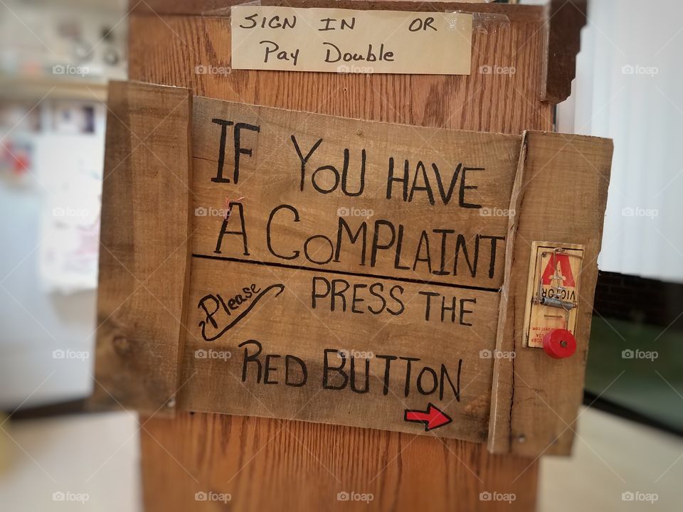 Wooden complaint box with red button