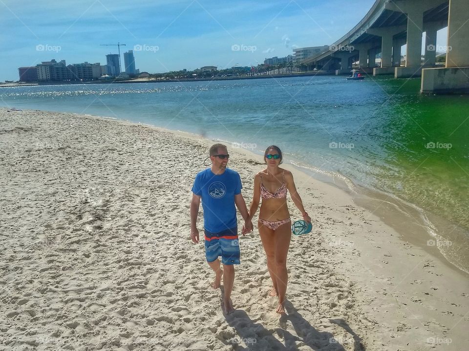 Couple walking on the beach