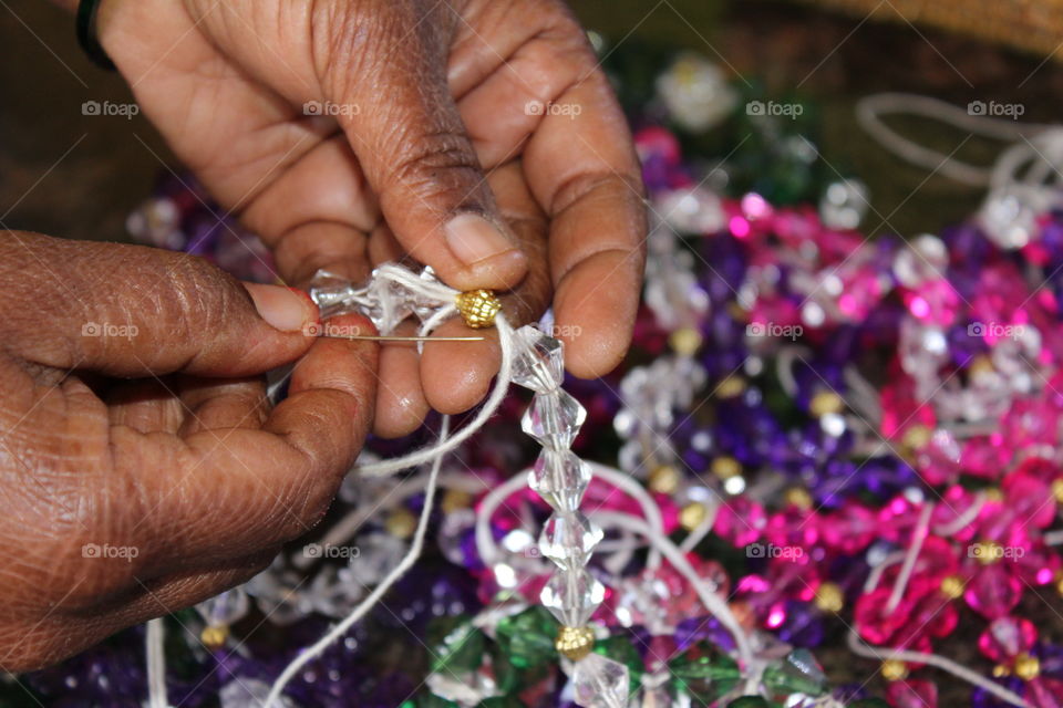 Woman preparing bracelet