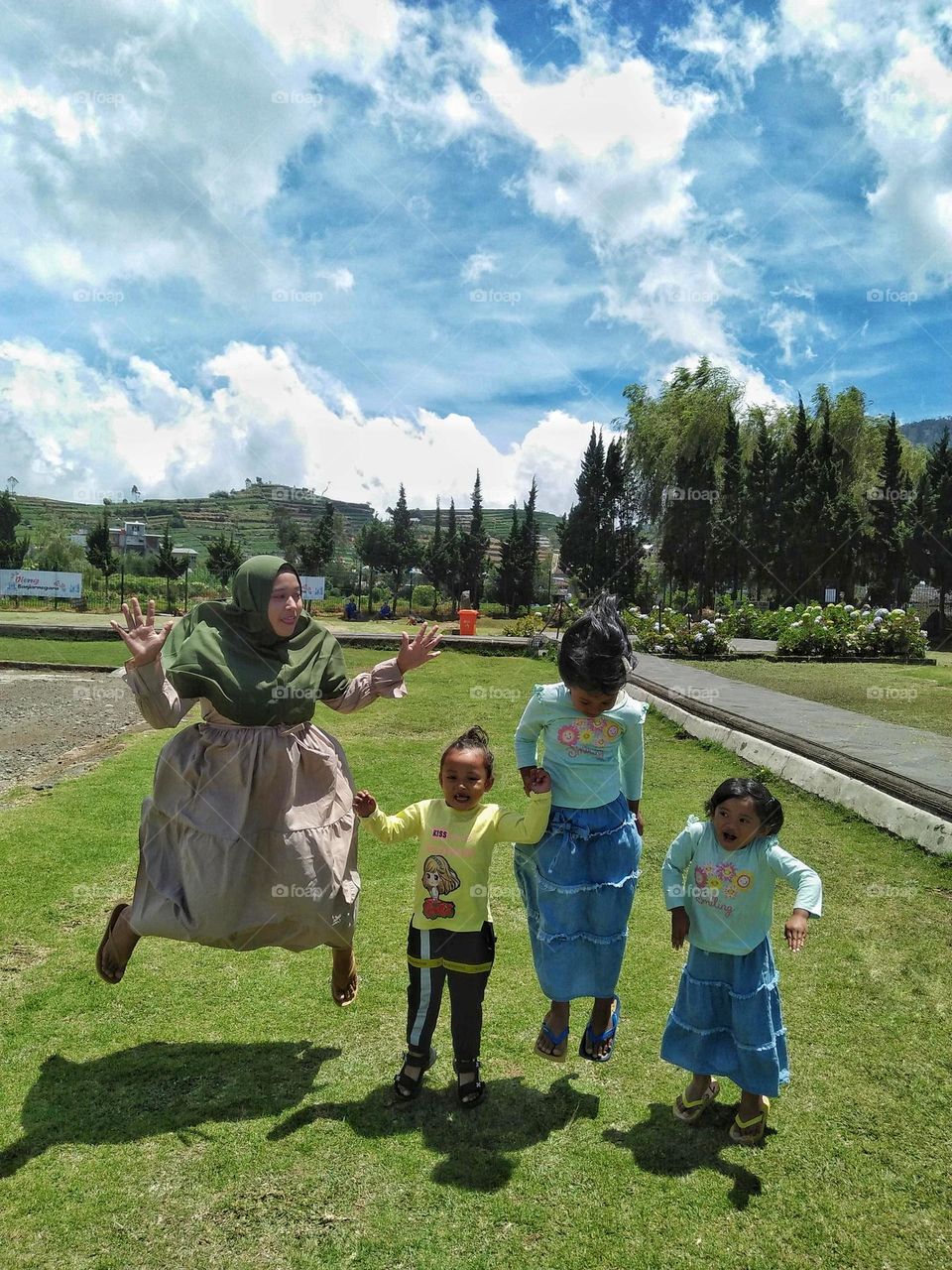 The whole family is having a great time on a temple tour in Indonesia.