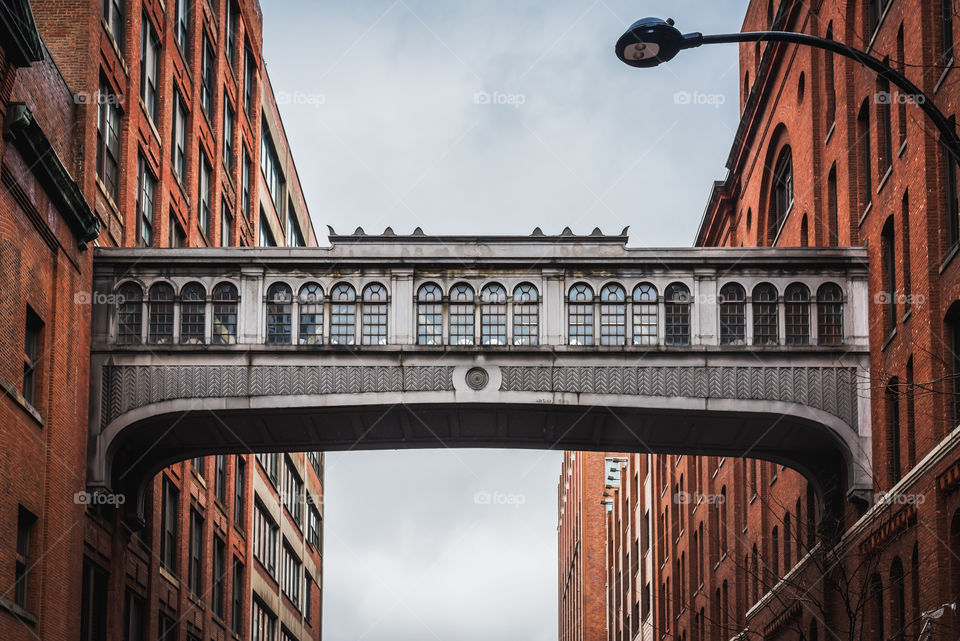 The foot bridge between two buildings over Chelsea market in New York from the High Line