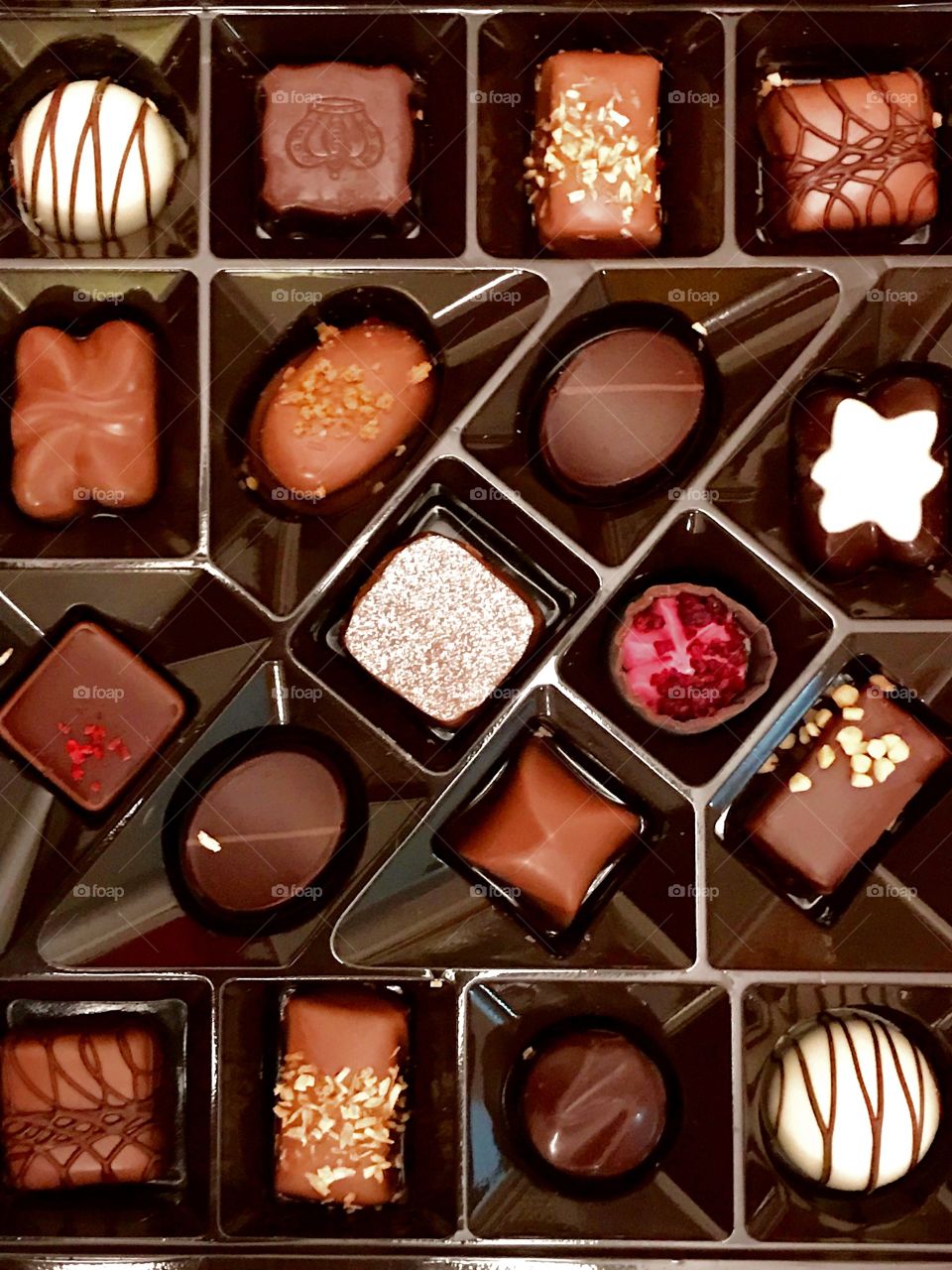Branded Chocolates arranged in a tray 