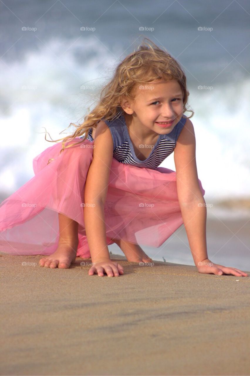 Smiling girl enjoying at beach