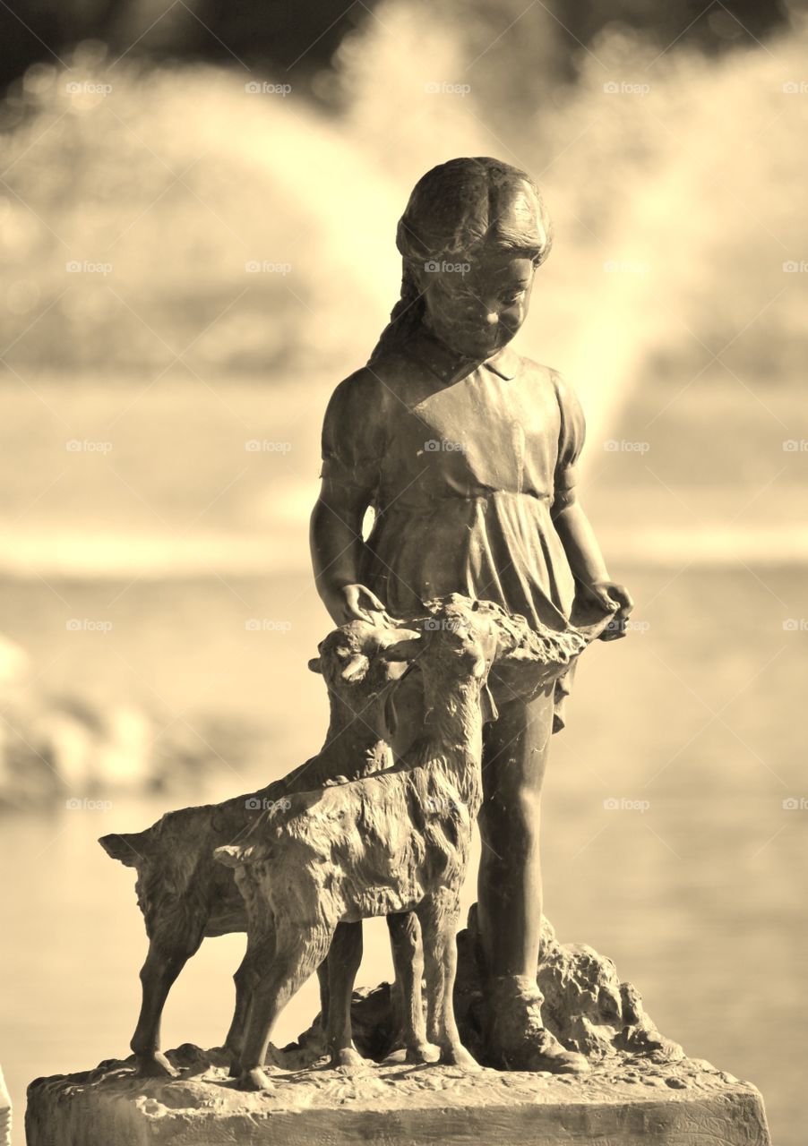 Statuary Art. Little Girl with a lamb