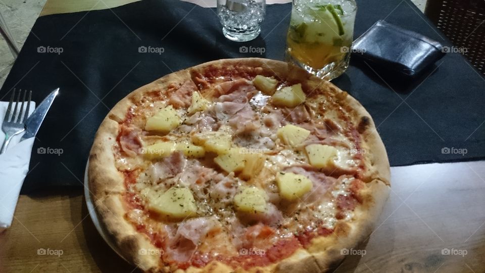 Pizza with mojito in Spain