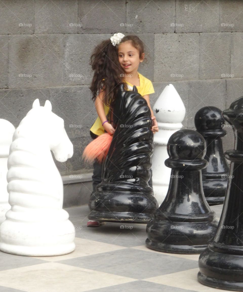 young girl playing chess in Erevan