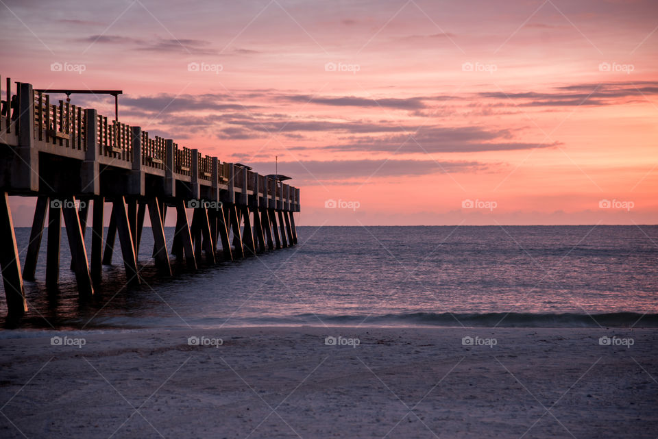Sunrise at Jacksonville Beach Fishing Pier in Florida