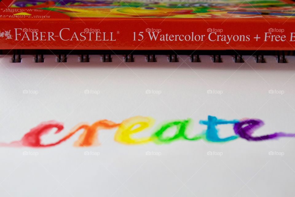 Colours of the World - watercolor crayon product box and the word “create” in rainbow colors on mixed media wire-bound paper