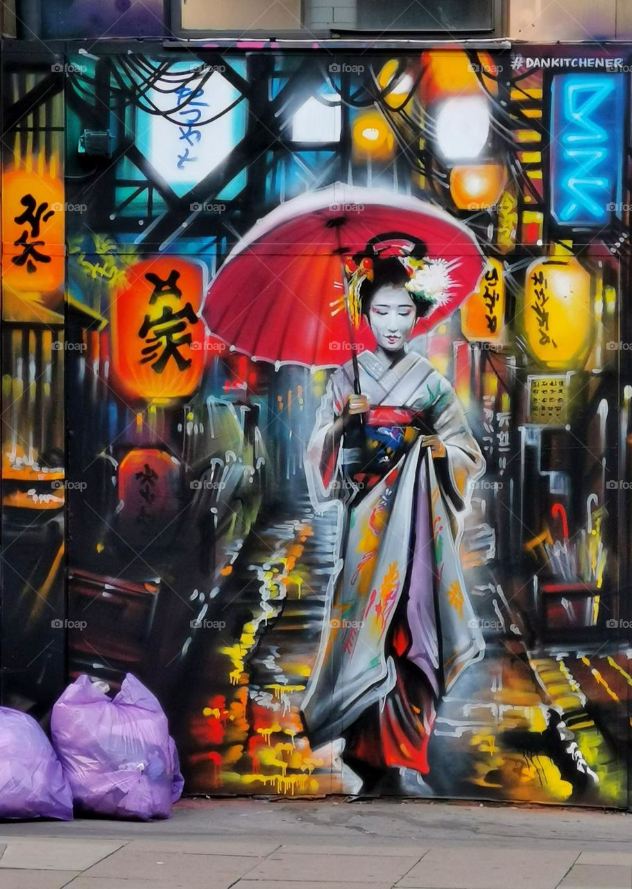 Visual street art, beautiful colourful murals. Street photo. Paintings on the wall. Geisha.