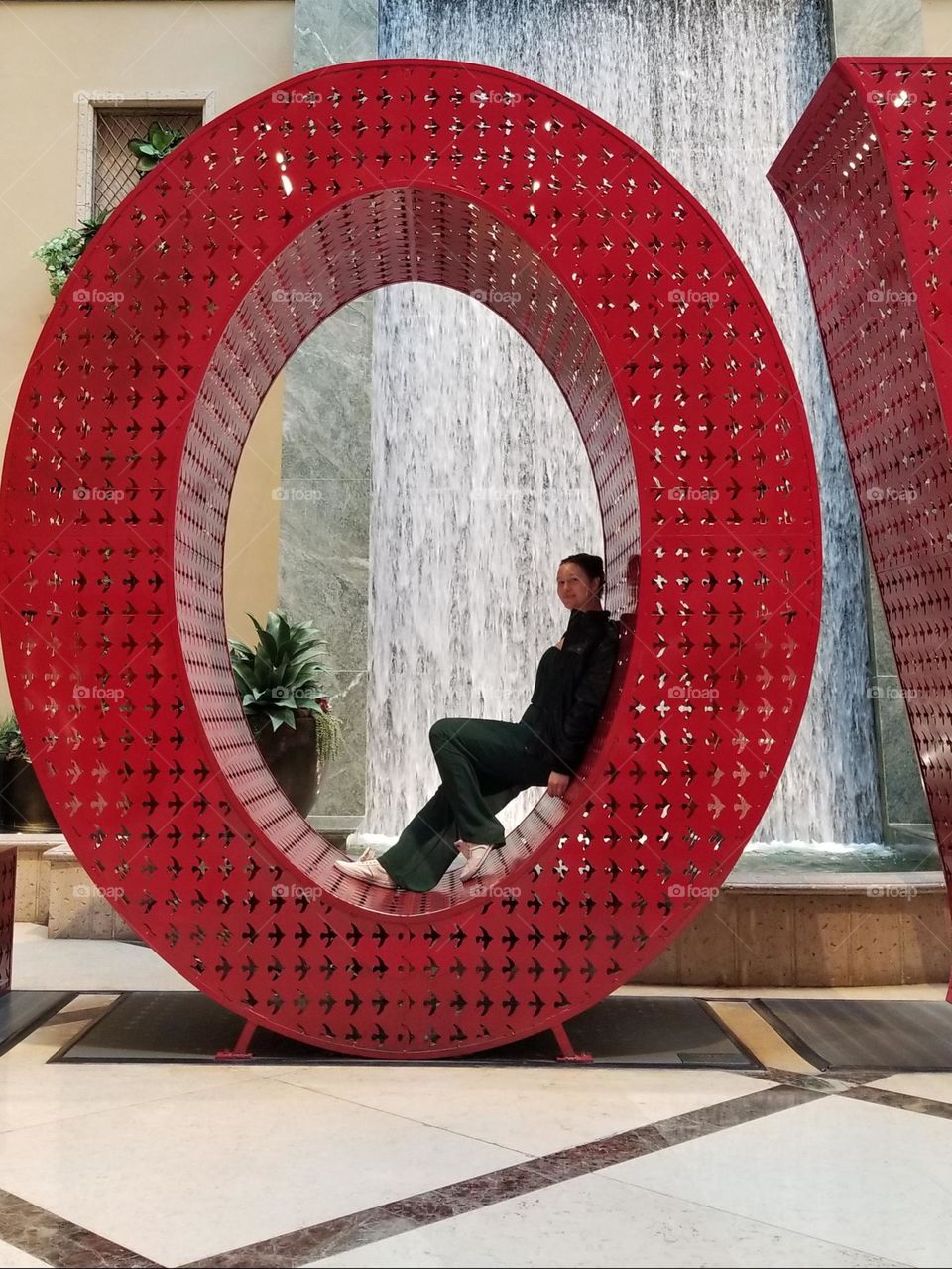 Having fun in a hotel display. Red letter 'O'.