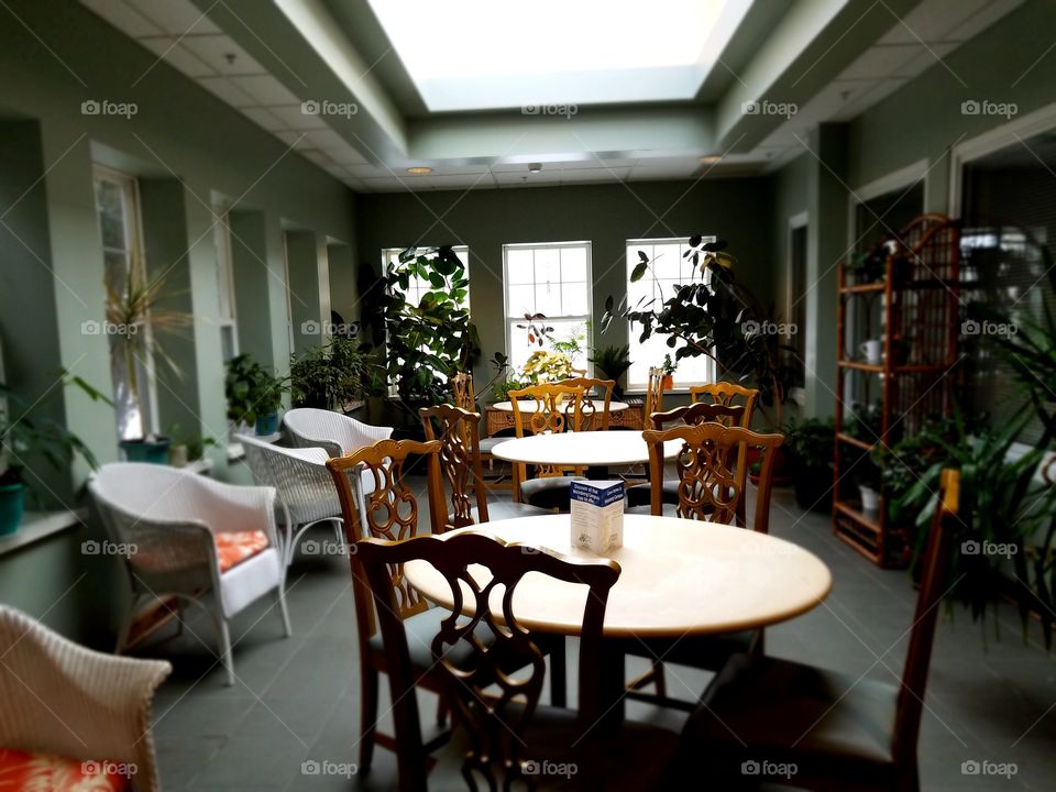 Sun room with tables and charis