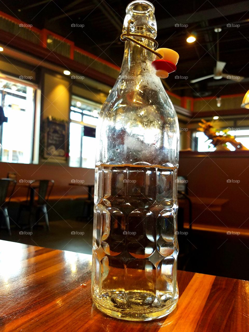 Refreshing glass bottle of ice water