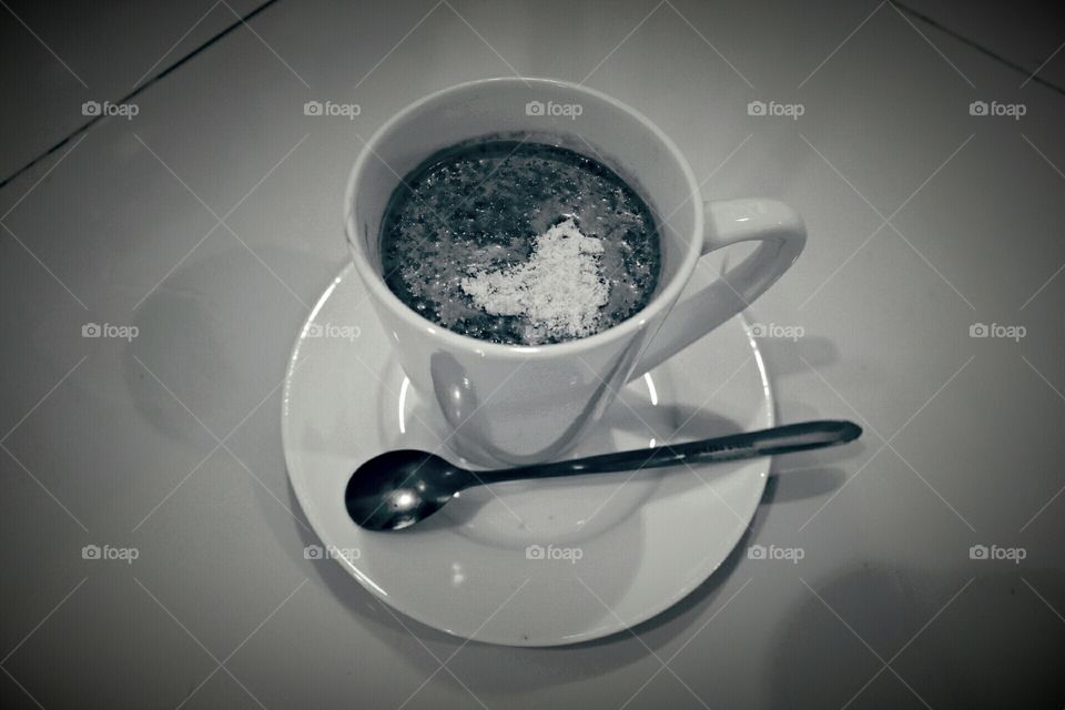 coffee with milk and oatmeal in black and white shot photo