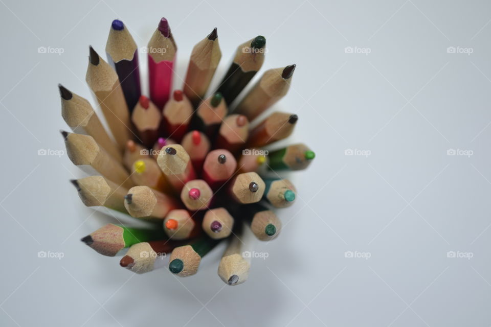 High angle view of pastel colored pencils