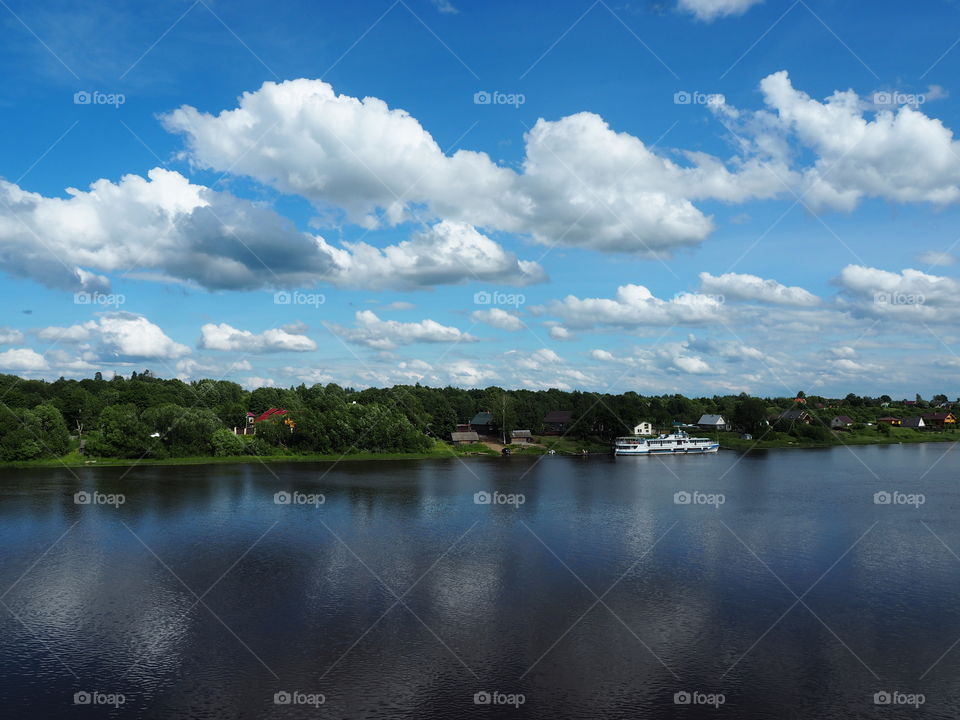 River. Summer. Blue sky. Clouds. Ship