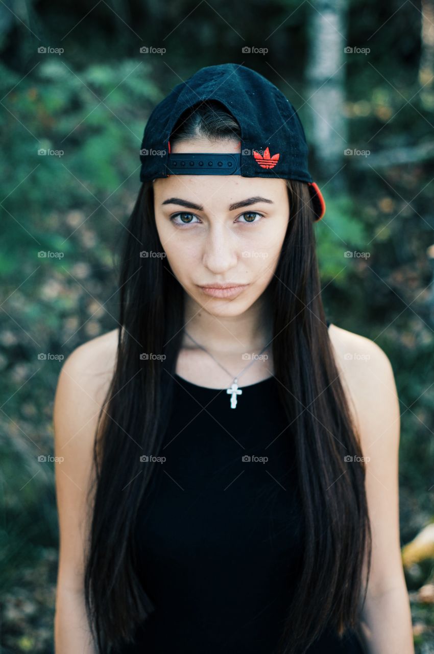 Teenage girl wearing cap