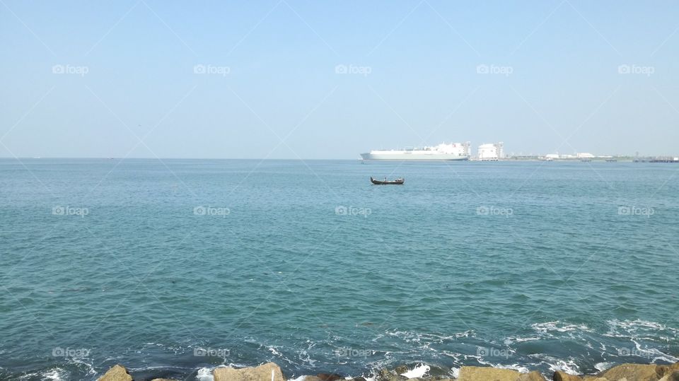 This boat was moving at the ocean very amezing place looking very wonderful