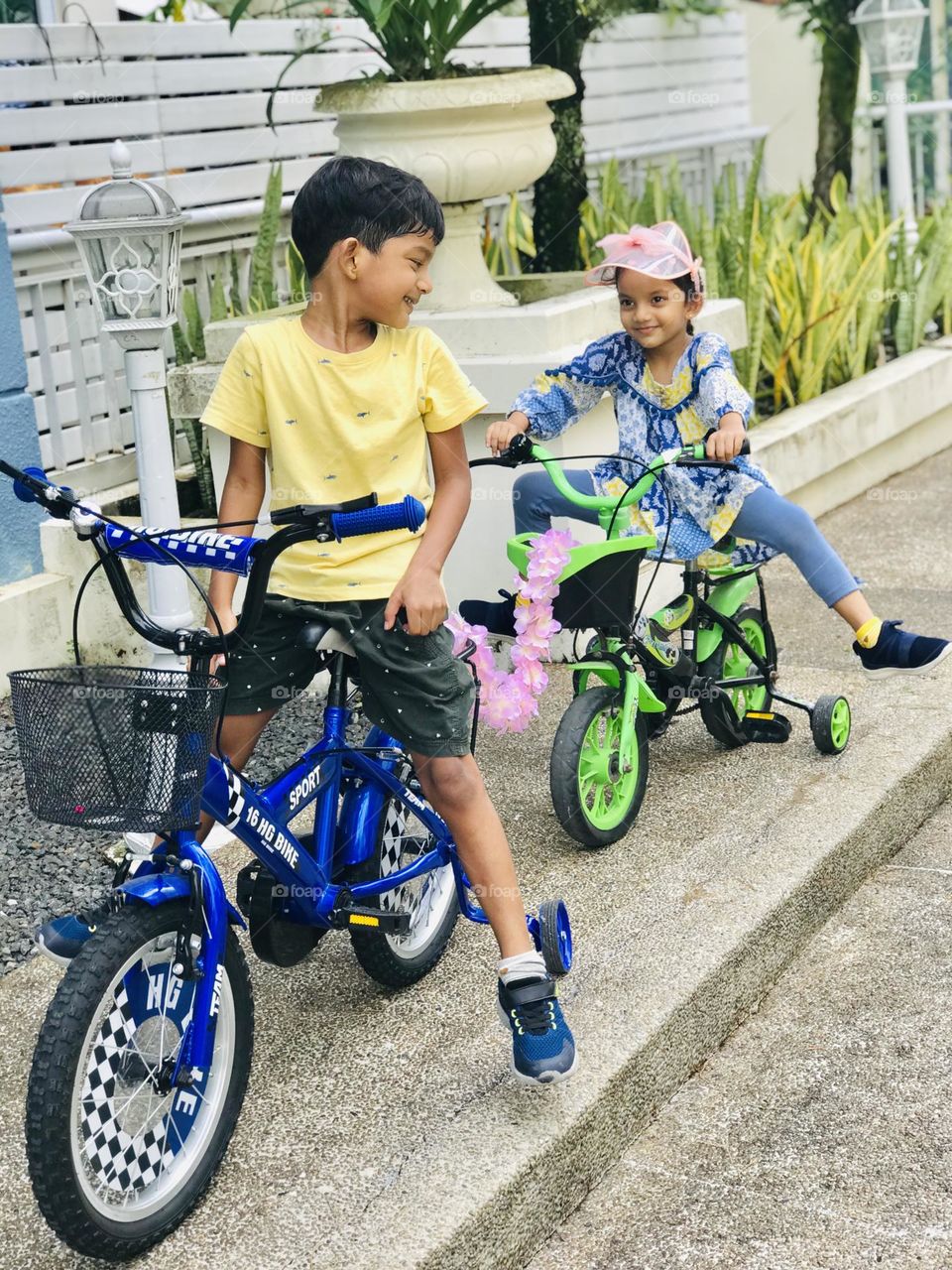 Boy and girl cycling and enjoying a lot 