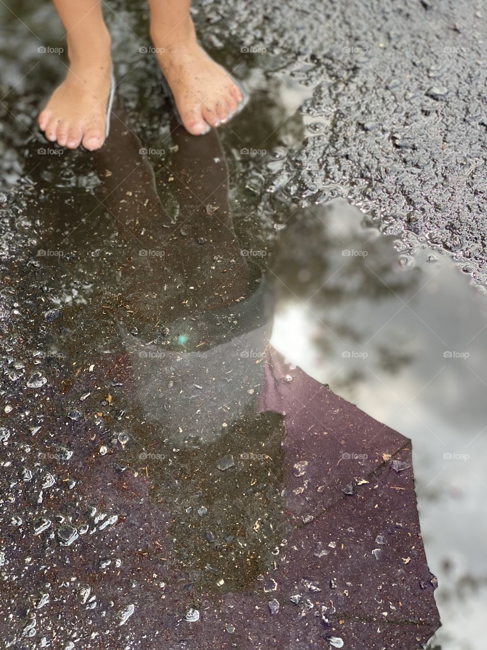 Seeing the world through the eyes of a child is exploring the wonders of jumping in puddles. 