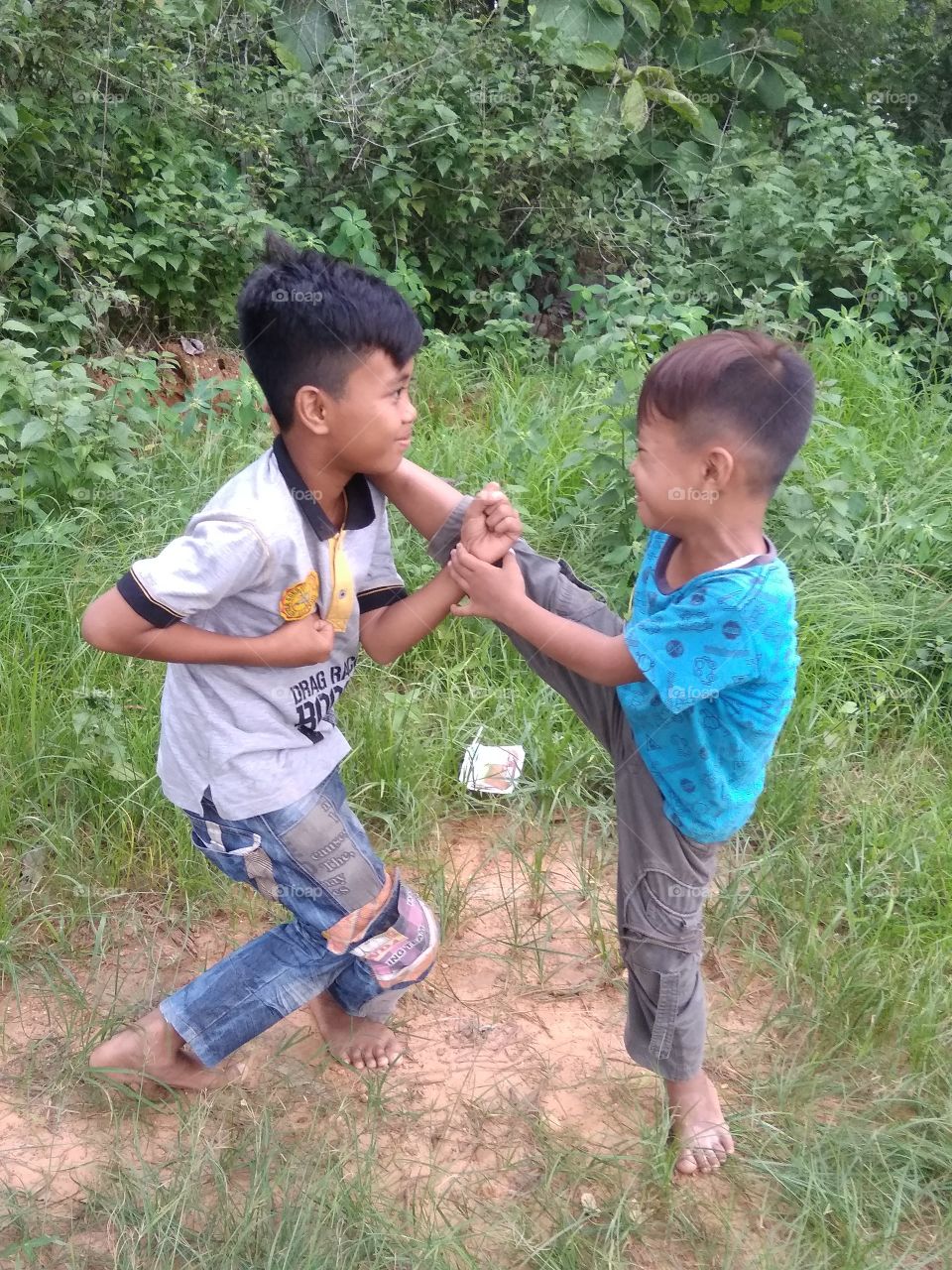 Another village kid acting silat