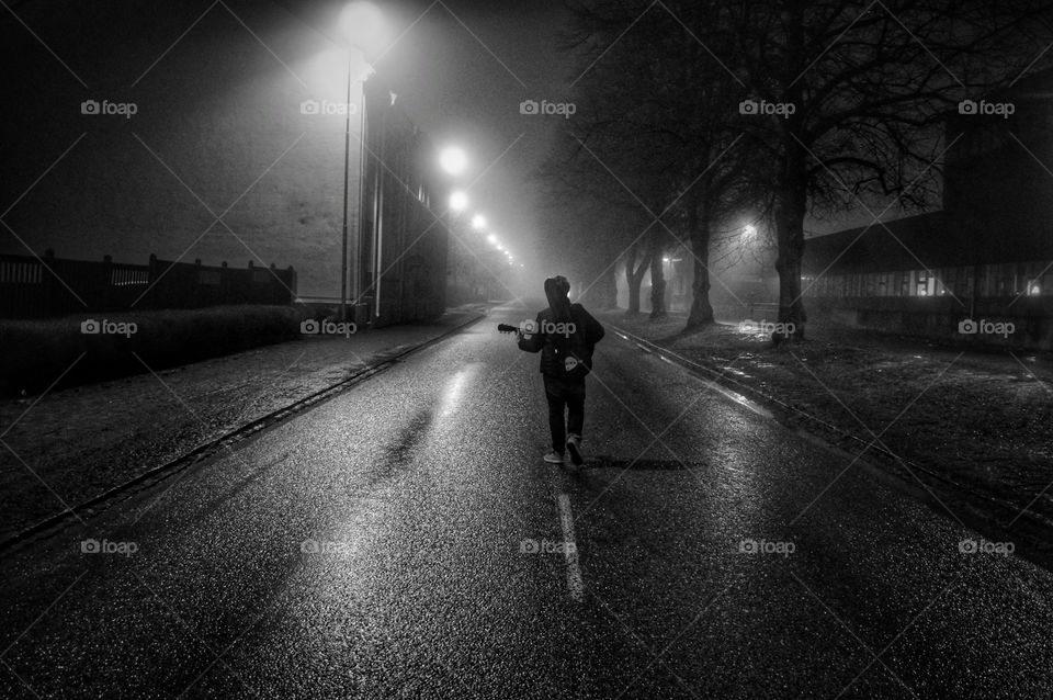 Man walking in the middle of the street