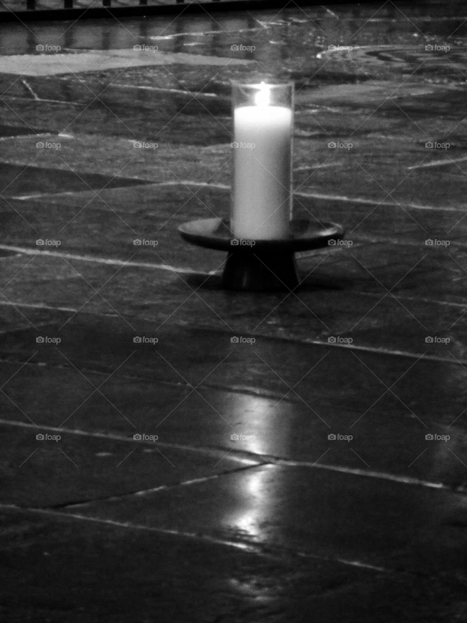 Memorial candle lit in a Cathedral