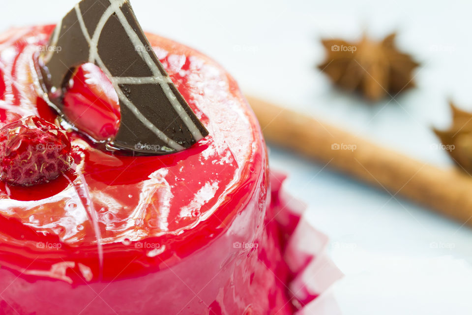 red cake with chocolate and raspberry.  close up